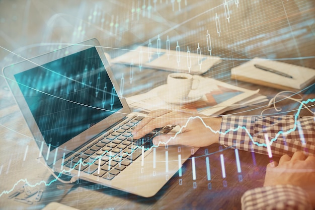 Double exposure of forex chart with man working on computer on background Concept of market analysis