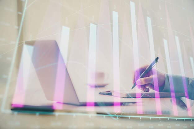 Double exposure of forex chart with man working on computer on background Concept of market analysis