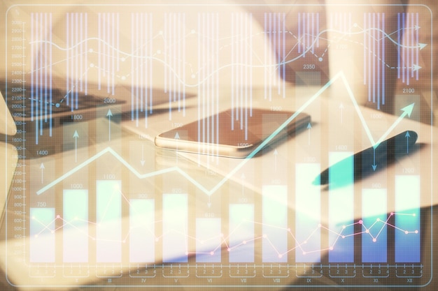 Double exposure of forex graph drawing and cell phone background Concept of financial data analysis