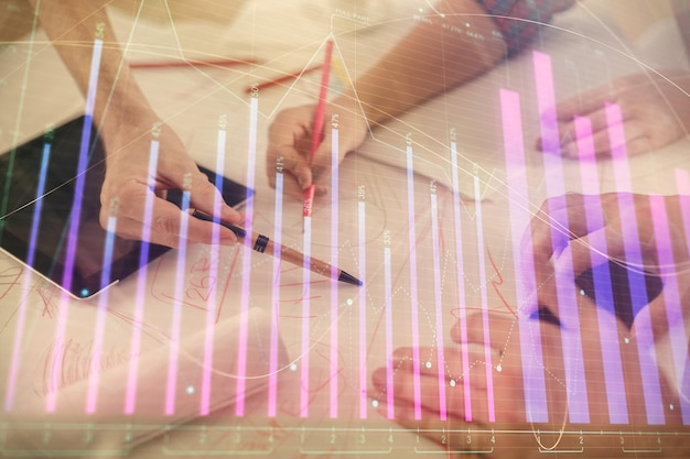 Photo double exposure of forex graph drawing and man and woman working together holding and using a mobile device trade concept