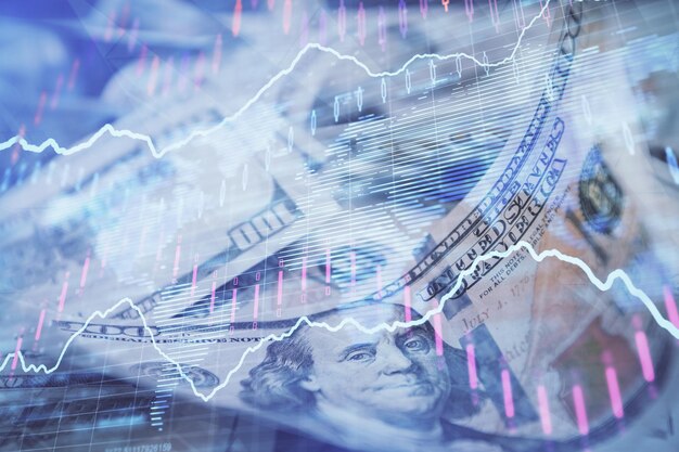 Double exposure of forex graph drawing over us dollars bill background Concept of financial markets