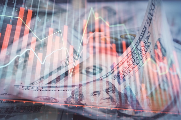 Double exposure of forex graph drawing over us dollars bill background Concept of financial markets