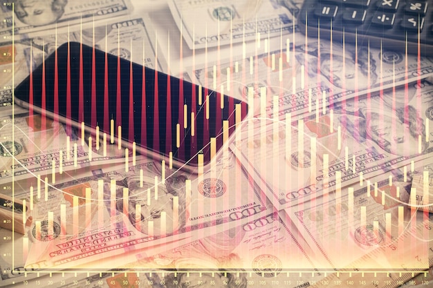 Double exposure of forex graph drawing over us dollars bill background Concept of financial markets