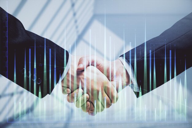 Double exposure of forex graph hologram and handshake of two men Stock market concept