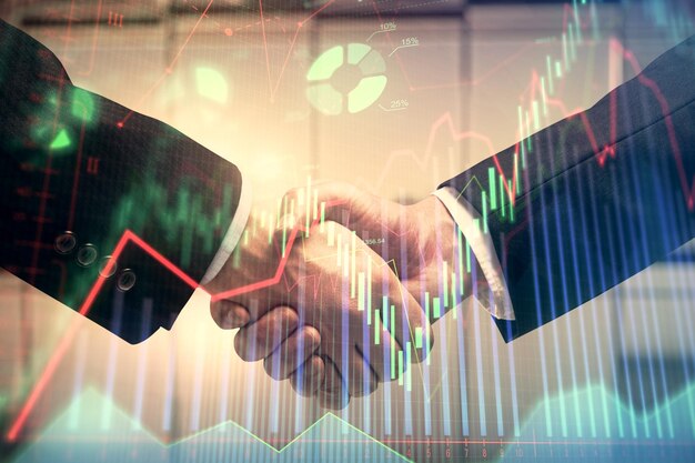 Photo double exposure of forex graph hologram and handshake of two men stock market concept