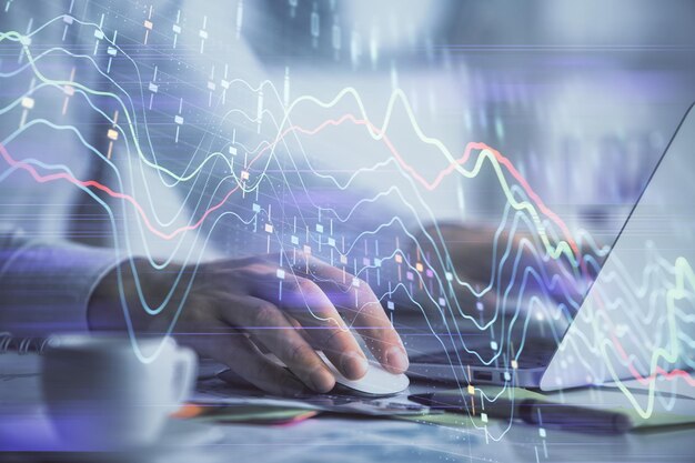 Double exposure of forex graph with man working on computer on background Concept of market analysis