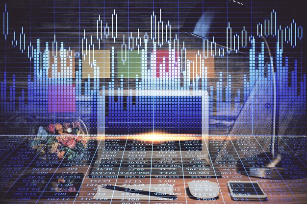 double exposure of forex graph and work space with computer concept of international online trading
