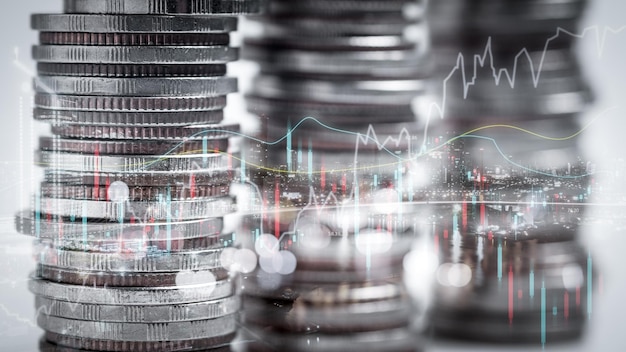 Double exposure of graph and rows of coins for finance saving banking business concept