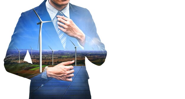 Double exposure graphic of business people working over wind turbine farm and green renewable energy worker interface. Concept of sustainability development by alternative energy.