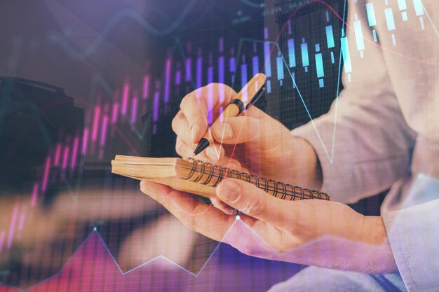 Double exposure hands with stock market chart Concept of research and analysis