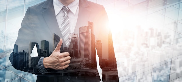 Double Exposure Image of Business Person on modern city background