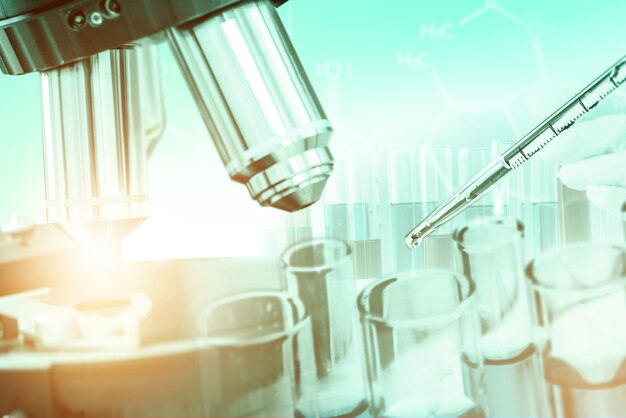 Double exposure image of microbiology and chemistry in laboratory for medicine study.