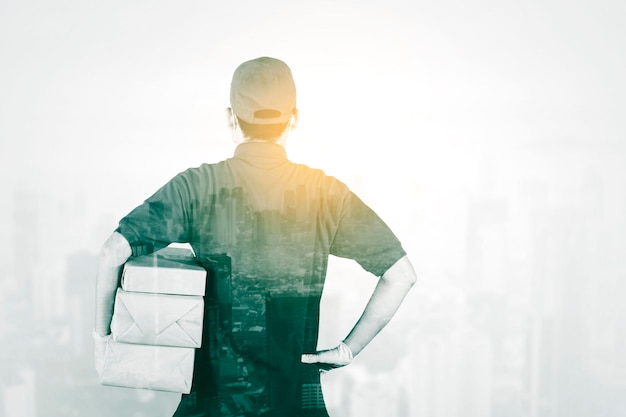 Double exposure of male courier holding package