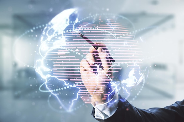 Double exposure of man hand with pen working with abstract digital world map hologram with connections on blurred office background big data and blockchain concept