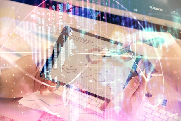 Double exposure of man's hands holding and using a phone and international business theme drawing