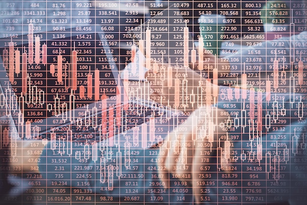 Double exposure of man and woman working together and forex chart hologram Business concept Computer background