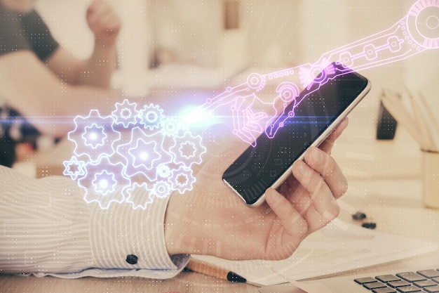 double exposure of mans hand holding and using a digital device and data theme hologram drawing technology concept