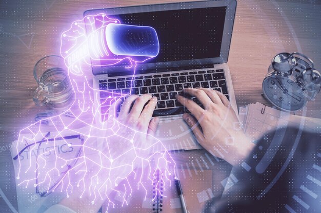 Double exposure of mans hands typing over computer keyboard and virtual reality hologram drawing Top view Technology concept Future