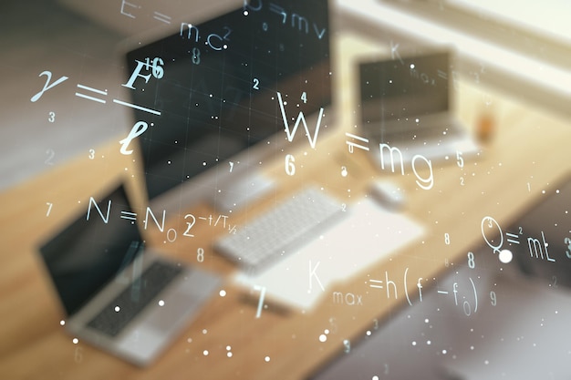 Фото Двойная экспозиция концепции творческой научной формулы и современного рабочего стола с ноутбуком на фоне концепции исследований и разработок