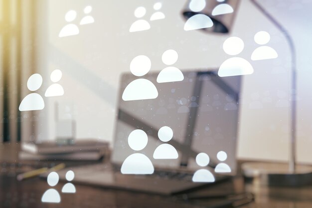 Double exposure of social network icons concept with modern laptop on background Marketing and promotion concept