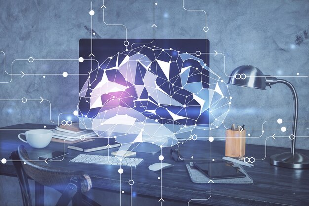 Double exposure of table with computer and brain hologram Data innovation concept