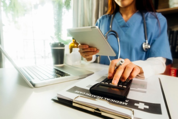 Double exposure of technology healthcare And Medicine concept Doctors using digital tablet and modern virtual screen interface icons panoramic banner blurred background