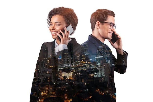 Double exposure of two young successful business people man and\
woman standing in front of asian city bangkok background concept of\
teamwork night time