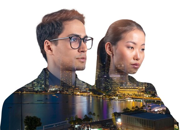 Double exposure of two young successful business people man and woman standing in front of Asian city Singapore background Concept of teamwork Night time