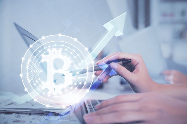 Double exposure of woman hands typing on computer and crypto market theme hologram drawing Blockchain concept