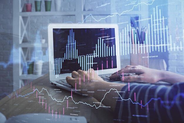 double exposure of woman hands typing on computer and forex chart hologram drawing stock market invest concept