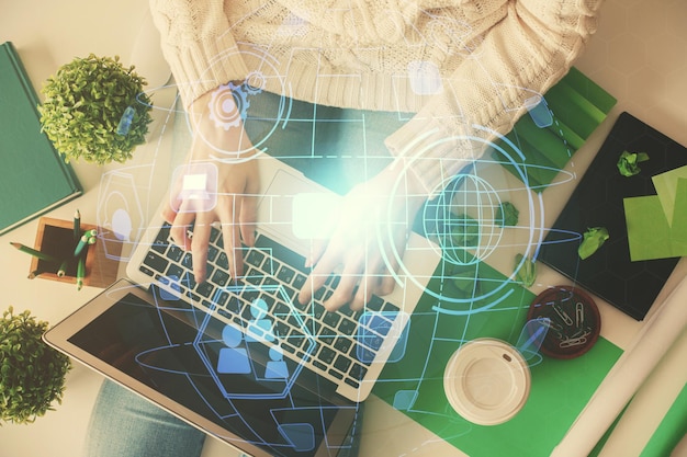 double exposure of woman hands working on computer and social network theme hologram drawing top view people connection concept