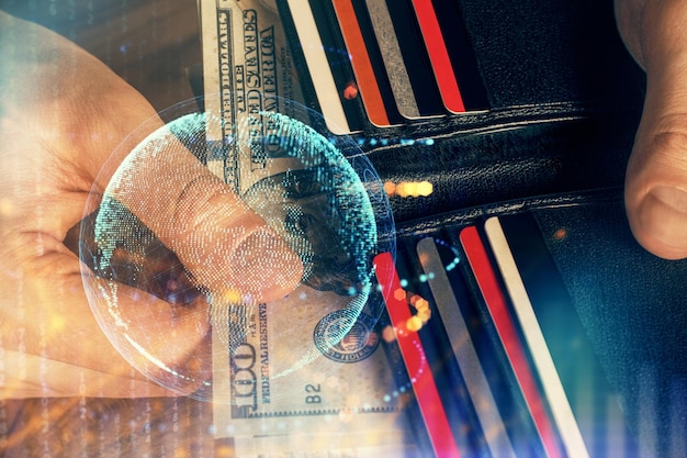 Double exposure of world map drawing hologram and us dollars bills and man hands