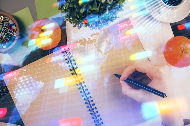 Foto doppia esposizione della mano di scrittura sullo sfondo con il concetto ai di ologramma della tecnologia della soluzione dati