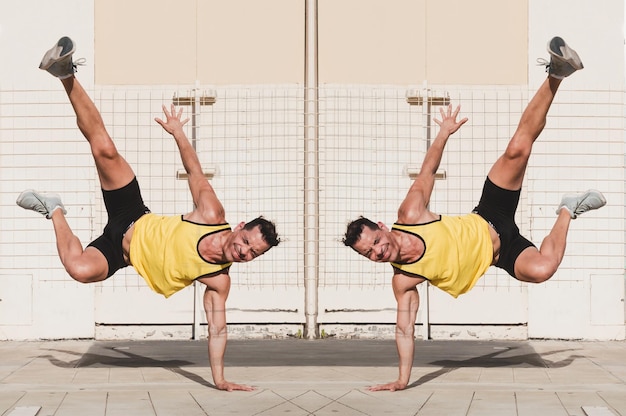 Double exposure of young caucasian man doing break dance outdoors