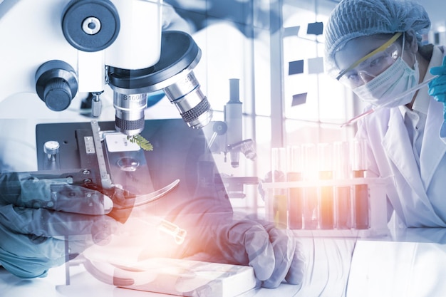 Double exposure Young woman scientific using equipment in the laboratory for research.Biotechnology,development,chemical,vaccine,study,COVID-19. Photo concept experimentation and research.