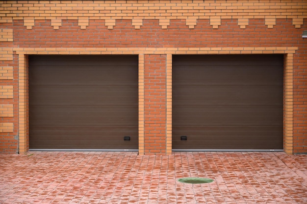 Double garage doors jalousie on red brick wall