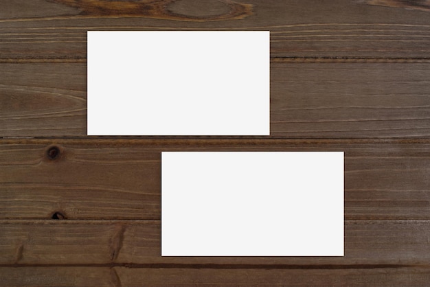 Photo double sided business card mockup on brown wood