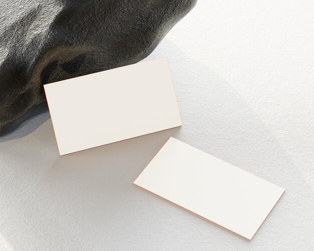 Double sided business card mockup White sheet of paper or blank business card template design near by rocks