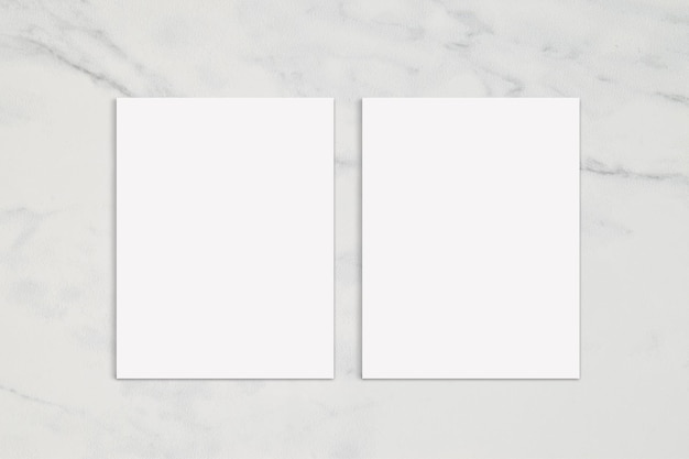 Photo double sided poster mockup on elegant white marble background with copy space