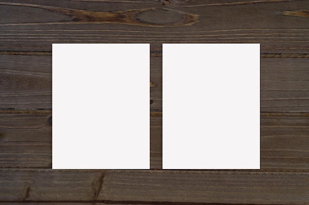 Double Sided Poster Mockup on Rustic Brown Background with Copy Space