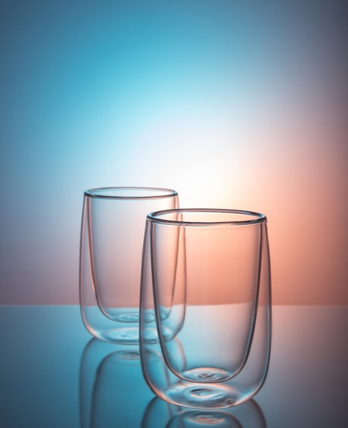 Photo double sided wall glasses on color background