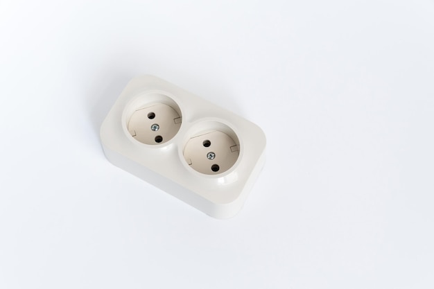 Double socket on a white background two sockets united by one monolithic case