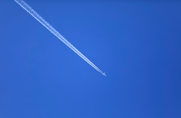 double track in the sky from a jet plane