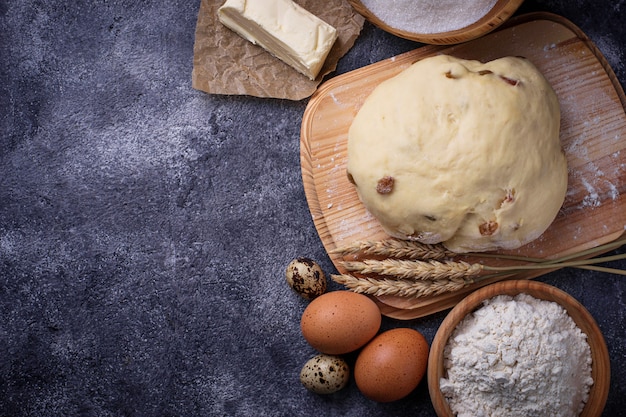 Dough and ingredients for baking. Egg, flour, sugar and butter. Selective focus