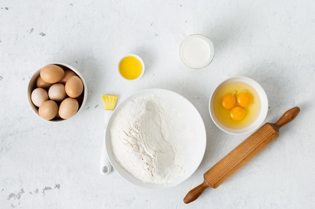 Dough ingredients on a white background top view