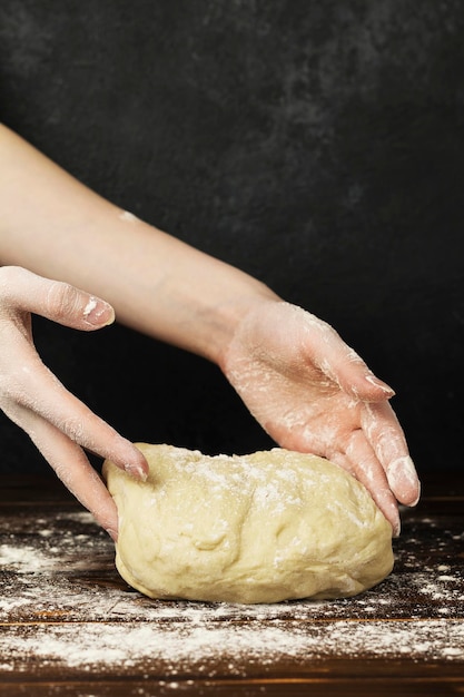 dough kneading on wooden table