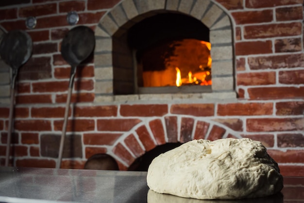 Photo dough with flour on table homemade pastry for bread or pizza bakery background