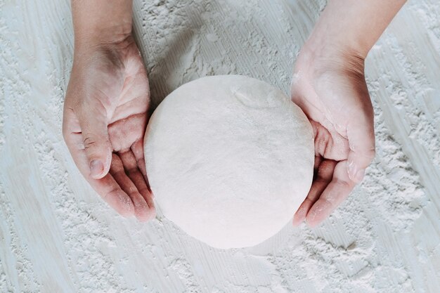 Dough with flour on a white background