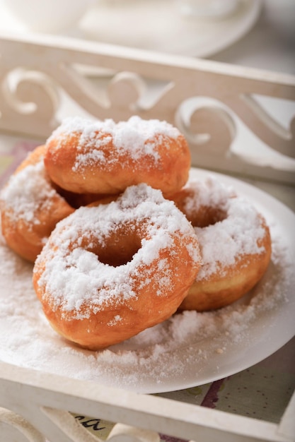 Doughnut or Donut or Donat is a Fried Snack made from a Mixture of Flour Sugar Eggs and Butter