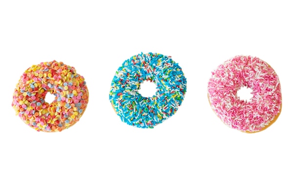 Doughnuts with colorful decoration on white color background Top view